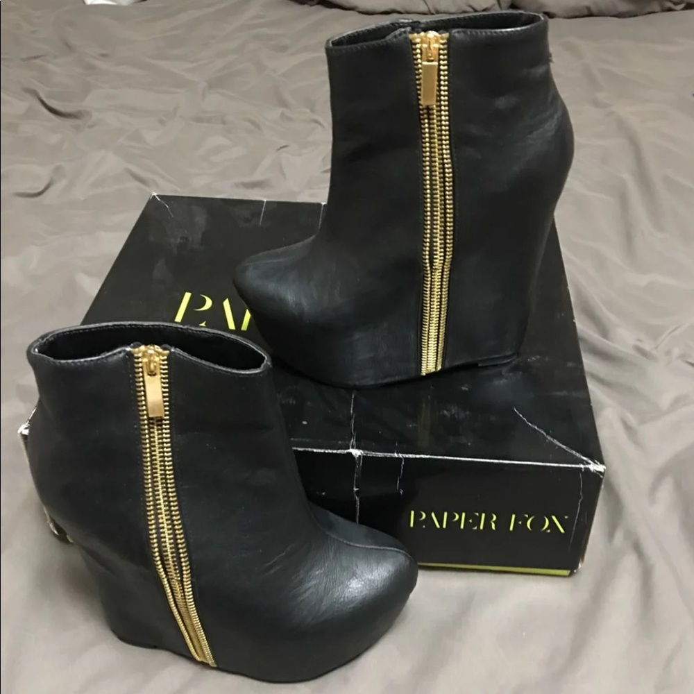 Leather and gold platform booties.